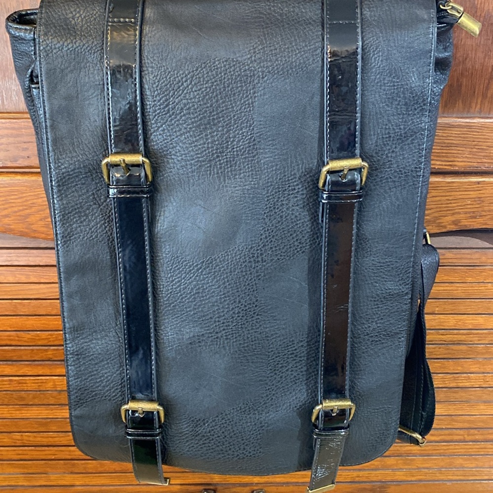 Cooperative: black vinyl backpack.